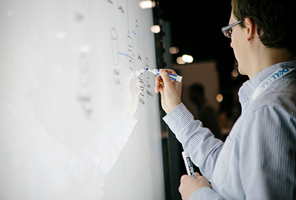 Man writing on whiteboard