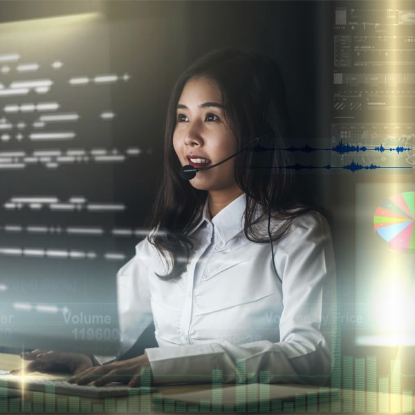 Asian Woman seat at a desk over visual screen of Internet of Things Technology